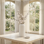 White fluted vase in a sunlit conservatory