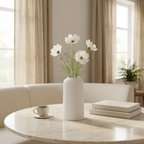 White fluted vase with delicate flowers in a luxury dining nook